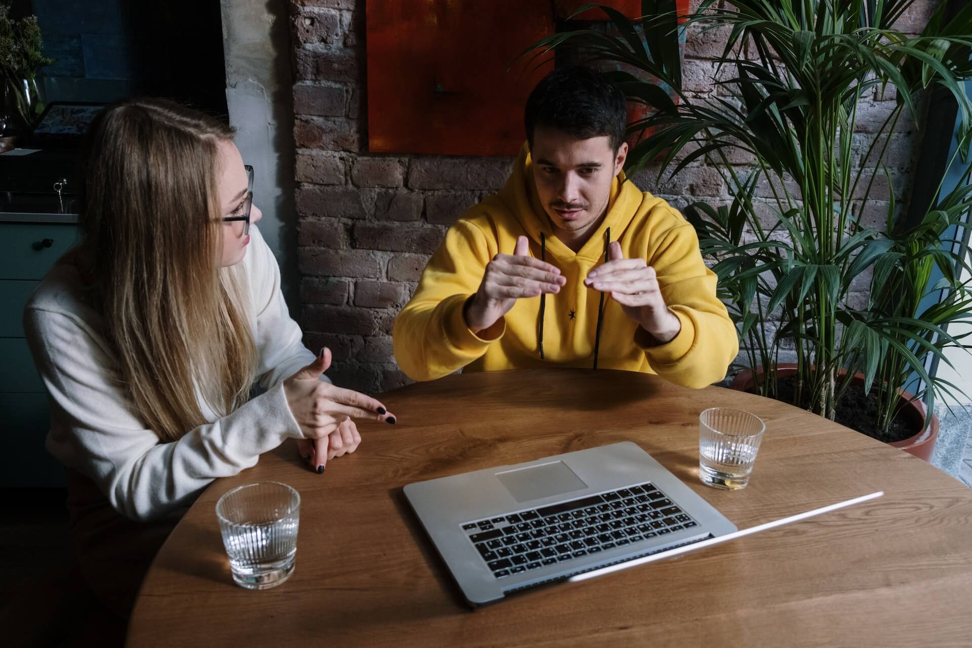 person explaining a topic on laptop
